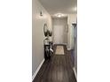 Inviting entryway with sleek dark wood flooring, stylish console table, and contemporary decor at 914 Baden Manor Dr, Indianapolis, IN 46217