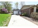 Long driveway leading to detached garage and back yard at 1229 Dallas Dr, Plainfield, IN 46168