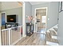 Entryway featuring wood floors, gray walls, and staircase leading to the upper level at 1229 Dallas Dr, Plainfield, IN 46168