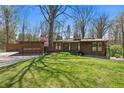 Charming one-story home featuring a well-maintained lawn, mature trees, and a welcoming facade at 00 Oak Rd, Westfield, IN 46074