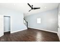Spacious living room with wood floors, modern paint, new lighting, and easy access to the entry at 1814 New St, Indianapolis, IN 46203