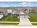 Inviting single-Gathering home with a three-car garage and beautiful landscaping at 19405 Titus Dr, Westfield, IN 46074