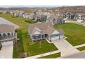 Desirable single-Gathering home on a well-manicured lot with beautiful landscaping at 19405 Titus Dr, Westfield, IN 46074