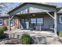 Inviting covered front porch with rocking chairs and ample seating at 19702 Tomlinson Rd, Westfield, IN 46074