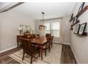 Elegant dining room with a wooden table, stylish decor, and ample natural light for memorable gatherings at 20133 Willenhall Way, Westfield, IN 46074