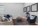 Comfortable living area featuring neutral tones, stylish furniture, and decorative accents at 2118 Lexington Ave, Indianapolis, IN 46203