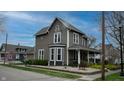 Charming two-story home with landscaped yard and inviting front porch at 300 E Monroe St, Franklin, IN 46131