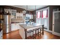 Spacious kitchen features an island with seating and stainless steel appliances at 300 E Monroe St, Franklin, IN 46131