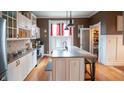 Bright kitchen features custom cabinets, an island and walk-in pantry at 300 E Monroe St, Franklin, IN 46131