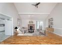Bright living room with vaulted ceilings, fireplace, and hardwood floors at 3462 Briar Creek Ln, Carmel, IN 46033