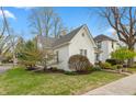 A lovely view of a beautiful home with manicured landscaping and lush green grass at 350 W Pearl St, Greenwood, IN 46142