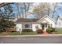 Charming home with a 'for sale' sign, nice yard, and a delightful backyard deck at 356 S Washington St, Danville, IN 46122