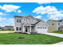 Beautiful two-story home with a two-car garage, covered entry, and landscaped front yard at 3727 Thomas Jefferson Ct, Westfield, IN 46074