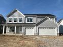 Beautiful two-story home with a three-car garage and stone accents under construction at 3847 Thomas Jefferson Ct, Westfield, IN 46074