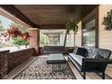 Inviting front porch with a comfortable seating area, perfect for relaxing outdoors at 40 N Ritter Ave, Indianapolis, IN 46219