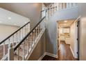 Elegant foyer featuring a staircase with white spindles and contrasting dark wood handrail at 416 Concord Way, Greenwood, IN 46142