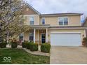 Charming home with a well-manicured lawn, beautiful landscaping, and attached two car garage at 4383 Round Lake Bnd, Indianapolis, IN 46234