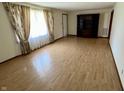 Spacious living room with hardwood floors and large windows allowing ample natural light at 508 E Hillside Dr, Anderson, IN 46011