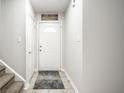 Inviting foyer with a white door, neutral paint, and tile flooring at 558 Prince Dr, Greenwood, IN 46142
