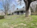 Charming single story home with a covered porch, perfect for enjoying the serene surroundings at 5846 Bellsville Pike, Columbus, IN 47201