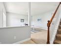 Bright landing area leads to a home office with a stairway and view of the office at 7354 Ponderosa Pines Ln, Indianapolis, IN 46239