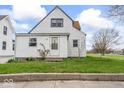 Charming two-story home with a cozy front porch and well-manicured lawn at 1126 N Anderson St, Elwood, IN 46036