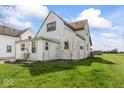 This two-story home has a well-manicured lawn and mature landscaping at 1126 N Anderson St, Elwood, IN 46036
