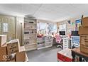 Bright home office with large windows, built-in shelving, and ample workspace at 1126 N Anderson St, Elwood, IN 46036