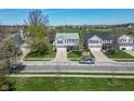 An aerial view showcases a home with blue shutters and a well-manicured lawn in a neighborhood setting at 12258 Weathered Edge Dr, Fishers, IN 46037