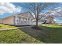 Quaint single-story home featuring a welcoming front porch and lush greenery surrounding the property at 14226 Marilyn Rd, Noblesville, IN 46060