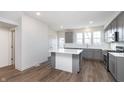 Spacious kitchen with an island, gray cabinets, stainless appliances, and bright, modern finishes at 14538 Hanford Ln, Carmel, IN 46074