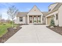 Charming single-Gathering home boasts a brick exterior, manicured lawn, and an attached garage at 1501 Chanson Ln, Westfield, IN 46074