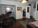 Inviting living room with hard floors, leather sofa and neutral paint at 1722 N Parker Ave, Indianapolis, IN 46218
