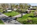 Well-manicured lawn surrounds a charming single-story home, providing a serene landscape at 1741 Terrace Ct, Franklin, IN 46131