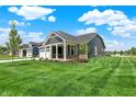 A beautiful home with a well-manicured lawn and newly planted trees in the yard at 19113 River Jordan Pass, Westfield, IN 46074