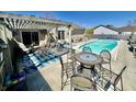 Inviting backyard patio with a pergola and outdoor dining set, perfect for entertaining and enjoying outdoor meals at 2509 Windsor Ct, Lebanon, IN 46052