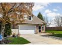 Beautiful townhome featuring well-manicured lawn and a two-car garage at 253 Provincial Ln # Apt D, Avon, IN 46123