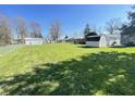 Spacious backyard featuring an outbuilding with a large, grassy lawn at 2575 S Indianapolis Rd, Lebanon, IN 46052