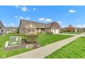 Well-maintained home with a lush green lawn and mature landscaping at 2601 Viceroy Ln, Lebanon, IN 46052