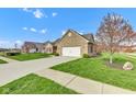 Beautiful brick home showcasing a pristine lawn, mature trees, and a long driveway at 2601 Viceroy Ln, Lebanon, IN 46052