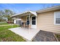 Outdoor patio features a table and chairs with a retractable awning at 3021 Midvale Dr, Indianapolis, IN 46222