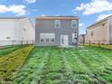 Fenced backyard featuring green grass and a patio with outdoor seating at 3053 Creekridge Ct, Columbus, IN 47201