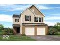 Charming two-story home features a brick facade, attached two-car garage, and well-manicured lawn at 3078 Creekridge Ct, Columbus, IN 47201