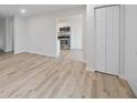 Bright living room showcasing hardwood floors and an open layout leading into the kitchen at 3648 Valley Lake Dr, Indianapolis, IN 46227