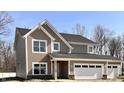 Craftsman-style home with a two-car garage, stone accents, shake siding, and horizontal siding at 3818 Thomas Jefferson Ct, Westfield, IN 46074