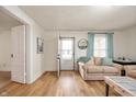 Inviting living room with wood floors, soothing colors, and an open layout to welcome guests at 419 S Oak St, Fortville, IN 46040