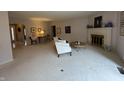 Bright living room with neutral carpet, fireplace, and ample natural light at 4586 Aldersgate Dr, Carmel, IN 46033