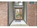 Inviting front entrance featuring a decorative glass door and 'Welcome' wreath at 5298 Royal Troon Way, Avon, IN 46123