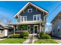 Attractive home with a covered front porch, perfect for enjoying the outdoors at 5442 Hibben Ave, Indianapolis, IN 46219