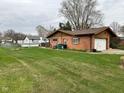 Spacious backyard with healthy lawn and partial fencing provides ample room for recreation at 5626 Hammon Dr, Brownsburg, IN 46112